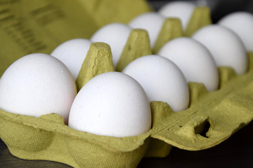 Fresh white eggs in a nest