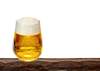 Disposable Beer glass on wooden table isolated on white background