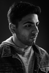 Young handsome Indian man in black and white
