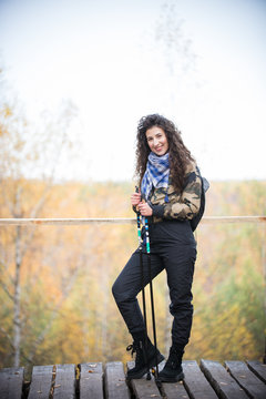 Young woman with attributes for nordic walking