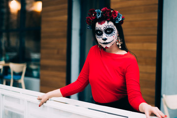 portrait of a girl in the city with a make-up, make-up for halloween, day of the dead, zombies. dead among us, ghost. walk of skeletons