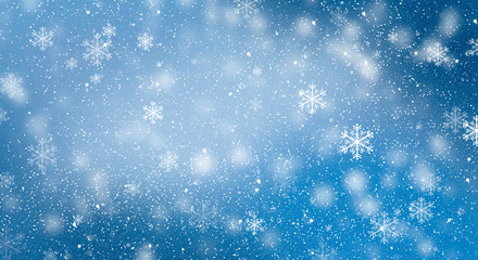 Blue bokeh background with snowflakes. Empty winter background, snowy, celebratory.