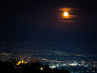 Fototapeta premium Chiang Mai landscape and red full moon and clouds