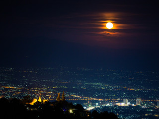 Fototapeta premium Chiang Mai landscape and red full moon and clouds