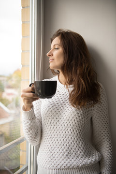 Adult woman with hot drink