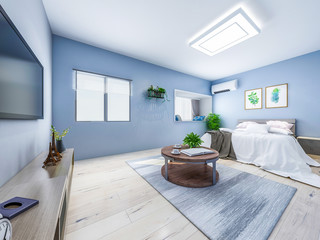 Modern bedroom with light blue walls with double bed, table, TV, wardrobe and greenery