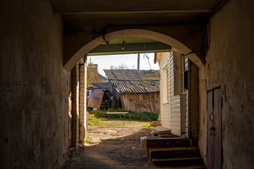 Fototapeta na wymiar The passage into the courtyard inside the old house in the city of Borovsk, Russia. October 2018 