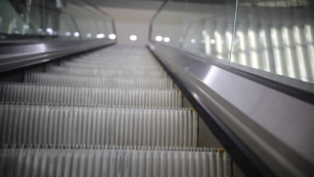 moving escalator up, mecanic, electic, Stair and escalators in a public area.