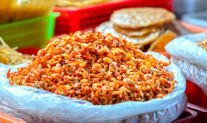 Dried shrimp is sold at seafood market in Vietnam. Shrimp is dried and peeled and eaten with carrots during the holidays