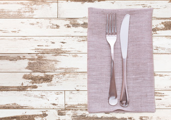 cutlery and napkin on wooden table. Mock up napkins for design. Napkins top view square.