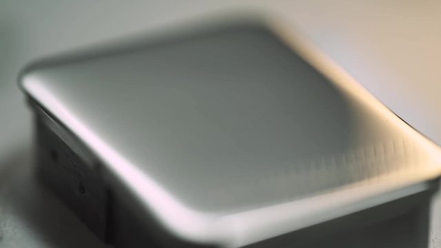 Production of watches, the process of laser engraving on a steel plate.