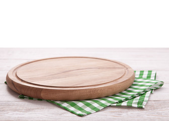 Pizza board, with napkin on wooden table isolated. Top view mockup