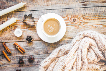 Christmas muffler with cup of cocoa wooden background top view
