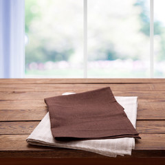 Napkin on the table and kitchen window blurred background