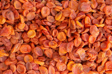 Dried apricots background, fruits preservation in market