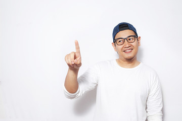 Naklejka premium Young Man Pointing Forward, Smiling Expression