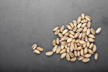 pistachios on black background