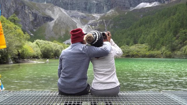 Hiking young couple traveler looking beautiful landscape at Yading Nature Reserve, Travel lifestyle concept