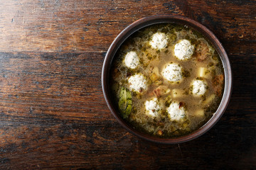 soup with meatballs in the plate