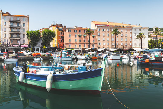 Fototapeta Wooden fishing boat moored in port, Corsica