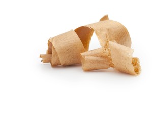 Wood chips, or wooden shavings isolated on white.