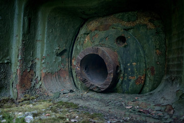 An abandoned bunker, an old military pillbox, an infantry weapon preserved after the war