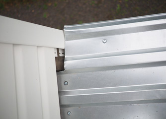 Construction of the frame house. Siding installation