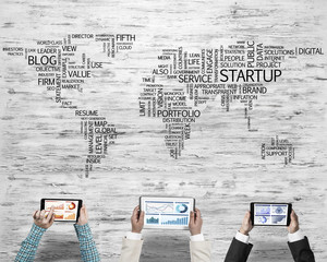 Top view of businesspeople sitting at table and using gadgets