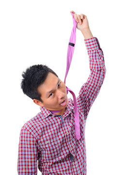 Young asian man hanging himself on his tie on white background