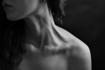 Girl's neck wtih dramatic light.