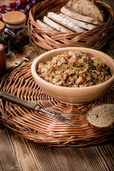 Obraz premium Bigos - stewed cabbage with meat,dried mushrooms and smoked sausage.