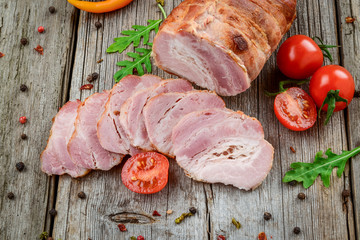 Smoked pork meat over the wooden background