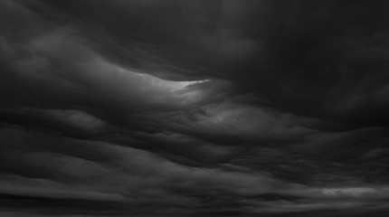 Fototapeta na wymiar Beautiful dark wavy clouds.