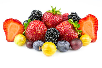 An assortment of summer berries is isolated on a white background.