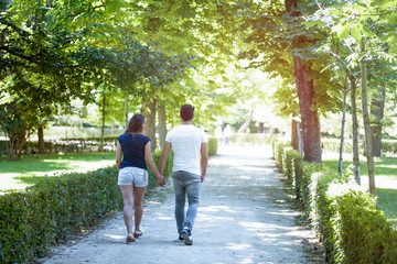 Young couple in love enjoy a sunny day in the park 