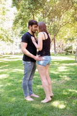 Fototapeta premium Young couple in love enjoy a sunny day in the park 