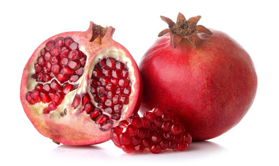 Big red pomegranate fruit and half pomegranate on white isolated background