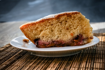Large shot of sponge cake plum pie.