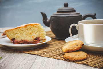 freshly baked biscuit plum cake and a hot cup of tea