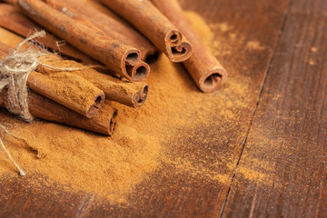 Cinnamon on wooden board.