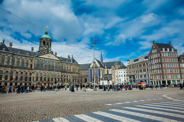 Dam Square and the Royal Palace at the Old Central district of Amsterdam in a cold early spring day