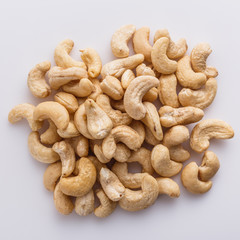 cashew nuts on a white acrylic background