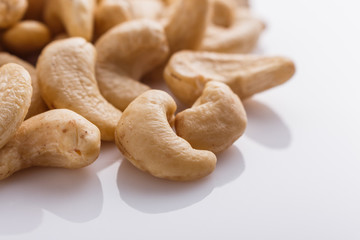 cashew nuts on a white acrylic background