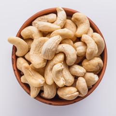 cashew nuts on a white acrylic background