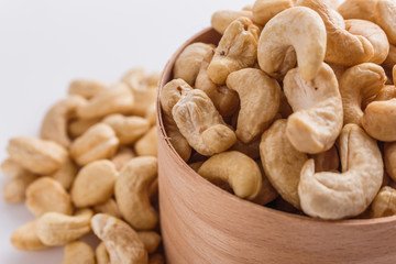 cashew nuts on a white acrylic background