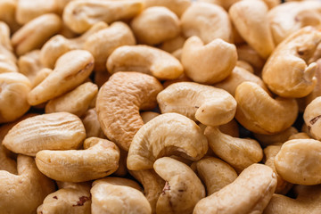 cashew nuts on a dark stone background