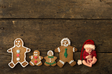 Newborn baby with gingerbread cookie family