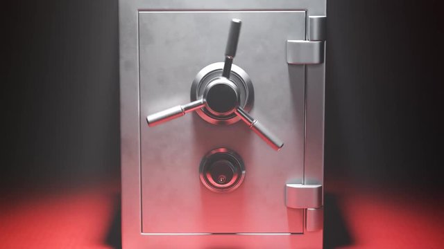 Empty steel safe on a red carpet in the spotlight.Vault doors are slowly opening