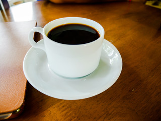 cup of coffee on wooden table