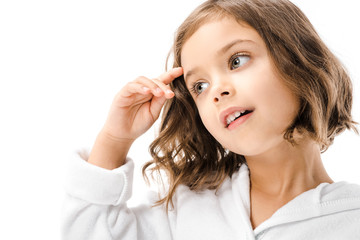 Naklejka premium portrait of adorable child in white bathrobe looking away isolated on white